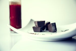 chocolate with red juice in background_ stock photo_COMPRESSED